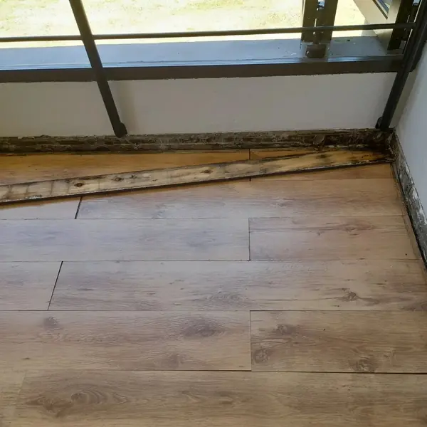 Before. Handyman job: balcony floor edge with rotten timber strip