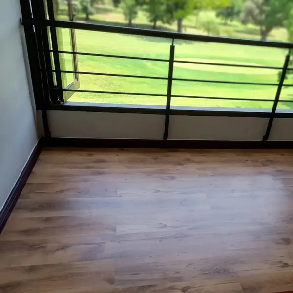 Handyman job: finished laminate balcony floor beside railing
