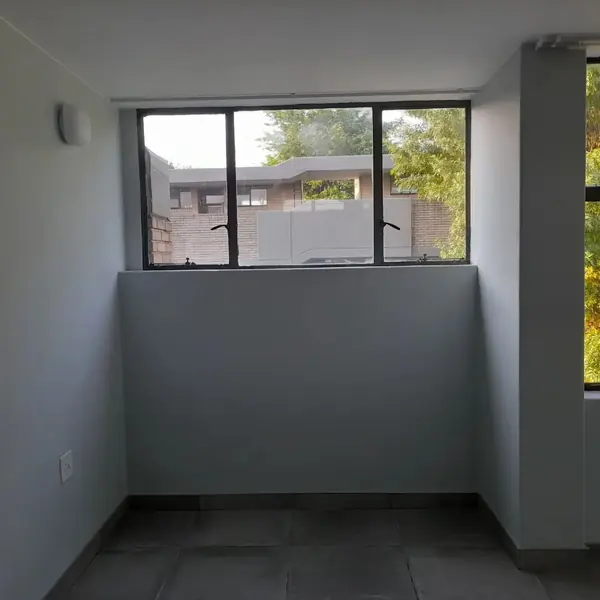 Painting job: freshly painted grey room, window, tiled floor